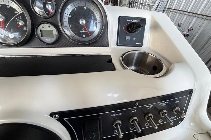 Slide: The Image of Control panel of 2017 Bayliner Element XR7 boat with gauges and switches. - 9