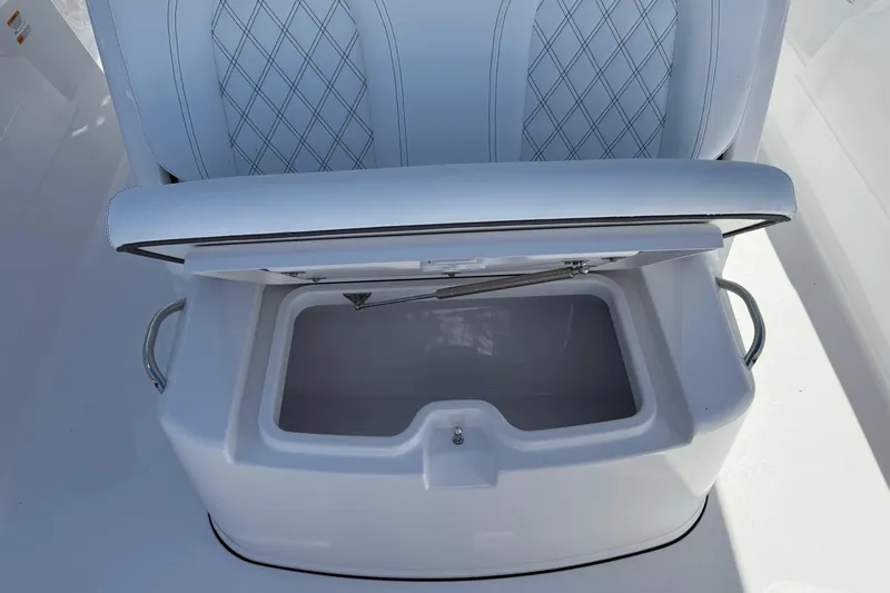 Slide: The Image of 2026 Sportsman Open 302 Center Console seat with storage compartment open. - 16