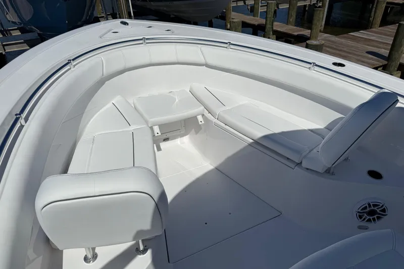 Slide: The Image of 2026 Sportsman Open 302 Center Console boat with spacious white seating area. - 17