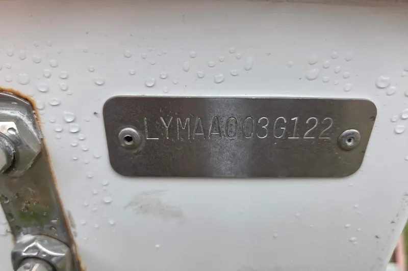 Slide: The Image of Metallic identification plate on Limestone L200CC 2022 boat, displaying serial number. - 13