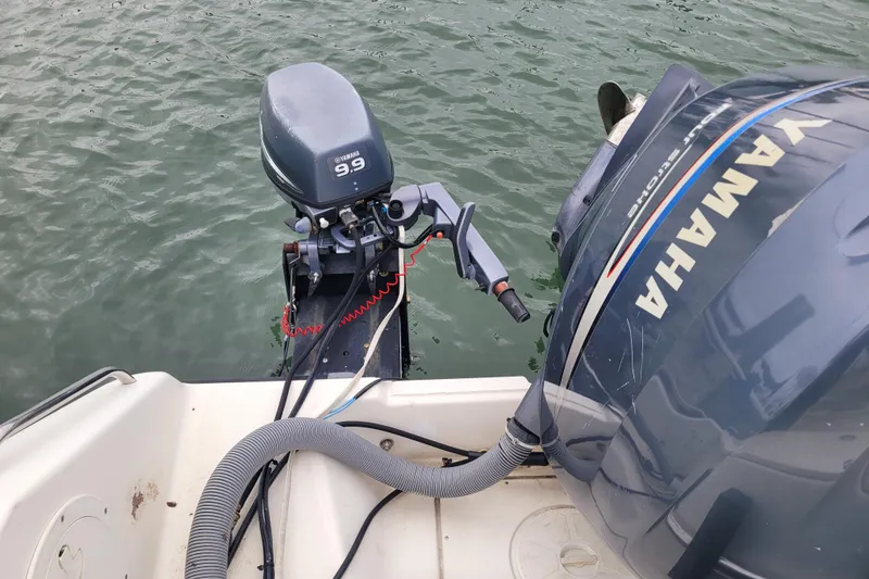 Slide: The Image of 2008 Pursuit C 250 Center Console with Yamaha outboard motors on water. - 13