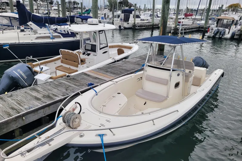 Slide: The Image of 2008 Pursuit C 250 Center Console boat docked at marina with Yamaha engine. - 19