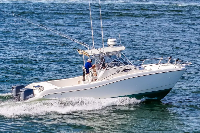 Slide: The Image of 2000 World Cat 266 SC boat cruising on the sea. - 22