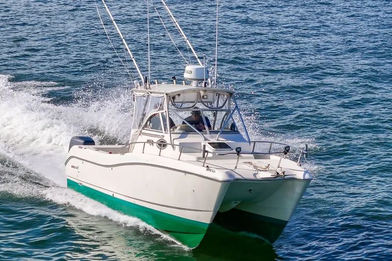 Slide: The Image of World Cat 266 SC boat from 2000 on the water. - 23