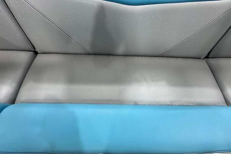 Slide: The Image of 2020 MasterCraft NXT22 boat seat with gray and blue upholstery. - 8