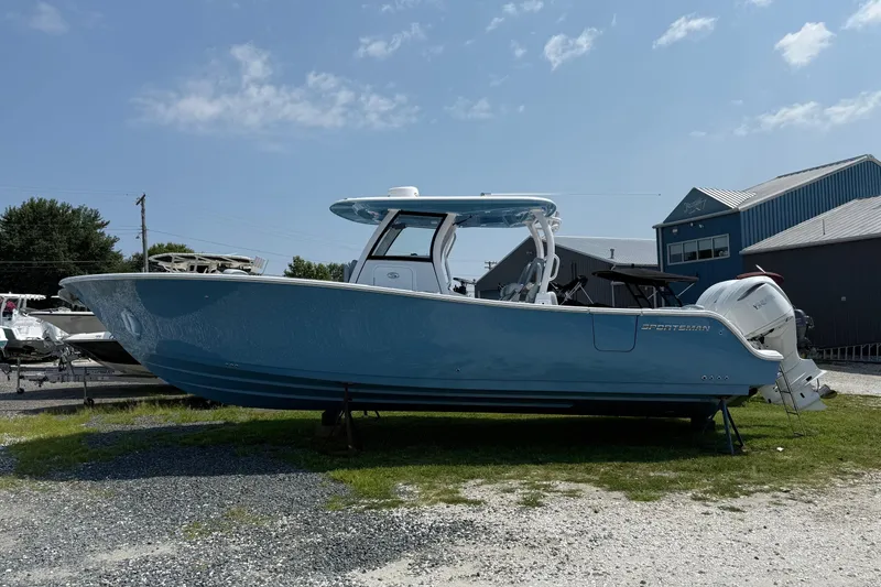 The Image of 2026 Sportsman Heritage 321 Center Console boat in a yard, side view. - 0