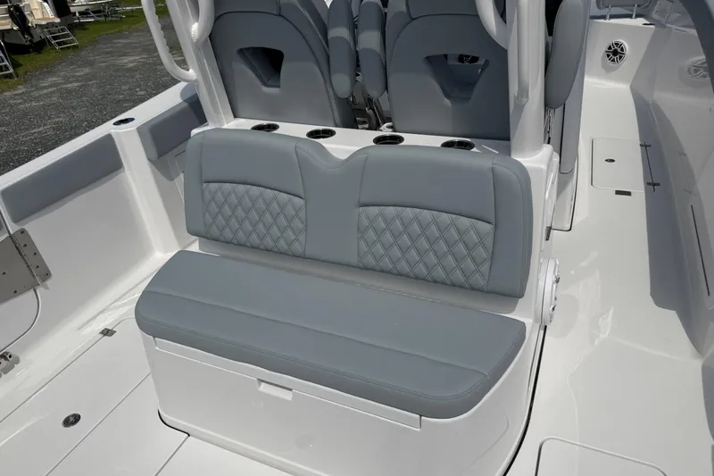 Slide: The Image of 2026 Sportsman Heritage 321 Center Console boat with stylish gray seating and cup holders. - 10