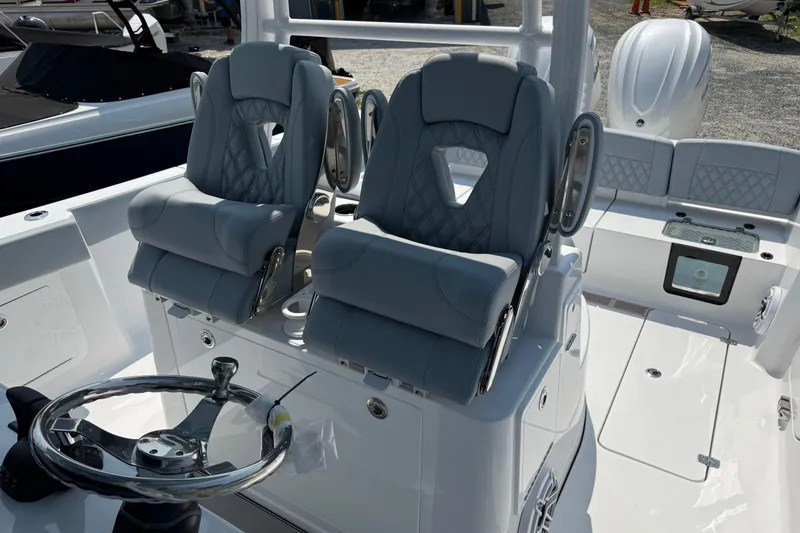Slide: The Image of 2026 Sportsman Heritage 321 Center Console with luxurious seating and modern steering wheel. - 20