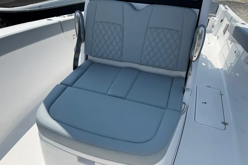 Slide: The Image of 2026 Sportsman Heritage 321 Center Console boat with luxurious seating and sleek design. - 29