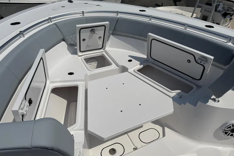 Slide: The Image of 2026 Sportsman Heritage 321 Center Console boat interior with open storage compartments. - 34