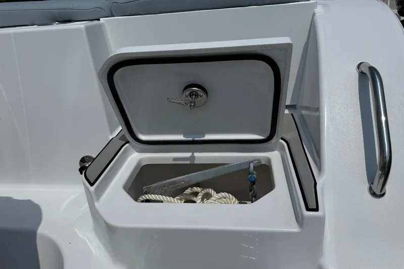 Slide: The Image of Open storage compartment on 2026 Sportsman Heritage 321 Center Console boat. - 9