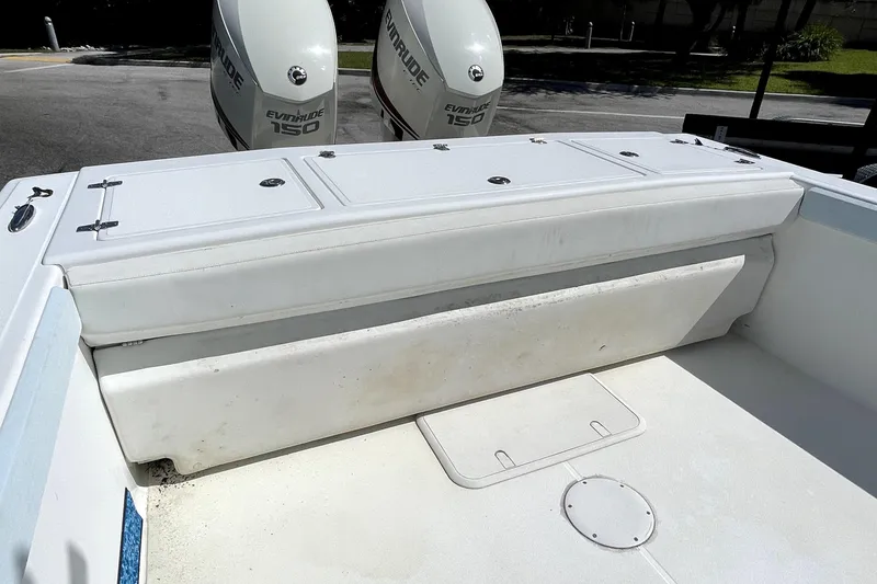 Slide: The Image of 2013 Ocean Master 27 Center Console boat with Evinrude 150 engines, rear seating view. - 4