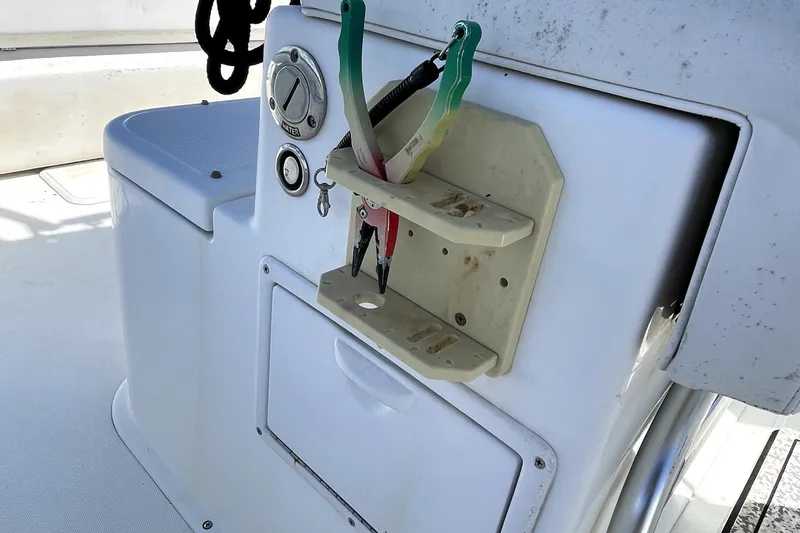 Slide: The Image of 2013 Ocean Master 27 Center Console boat with tool storage and control panel. - 6