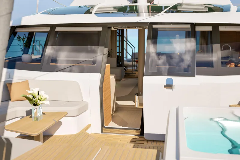 Slide: The Image of Luxurious 2027 Fountaine Pajot 70 S yacht interior with elegant seating and ocean view. - 21