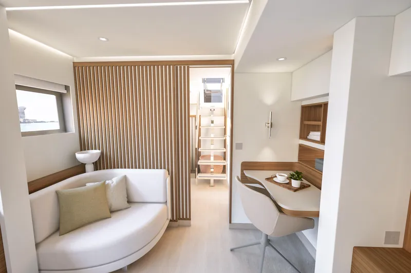 Slide: The Image of Luxurious interior of 2027 Fountaine Pajot 70 S yacht with modern seating and workspace. - 36