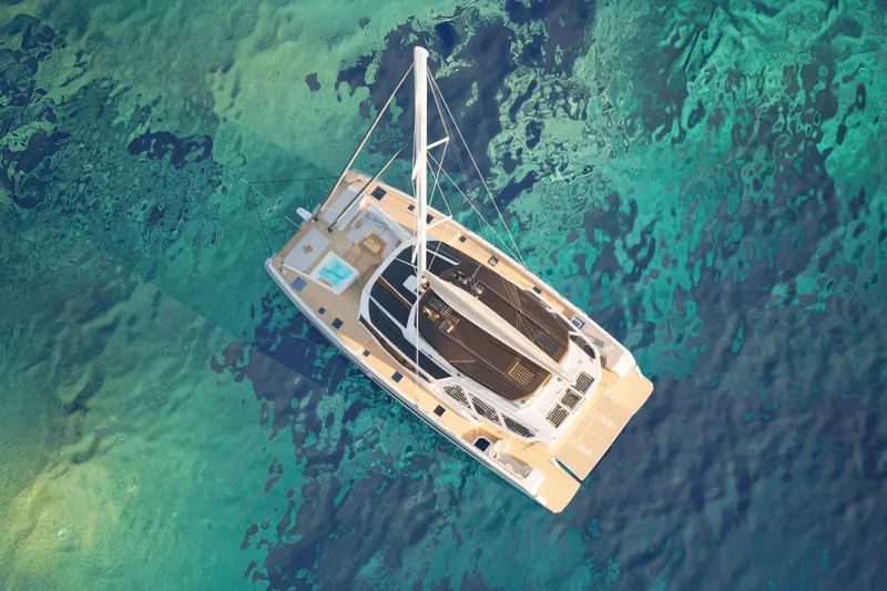 Slide: The Image of Aerial view of 2027 Fountaine Pajot 70 S catamaran on turquoise water. - 6
