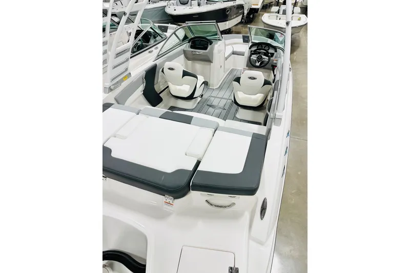 Slide: The Image of 2026 Chaparral 19 SSi OB boat interior with sleek seating and modern design. - 13
