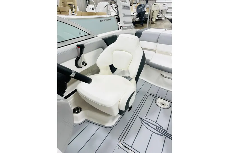 Slide: The Image of Interior of 2026 Chaparral 19 SSi OB boat, featuring sleek white seating and modern design. - 5