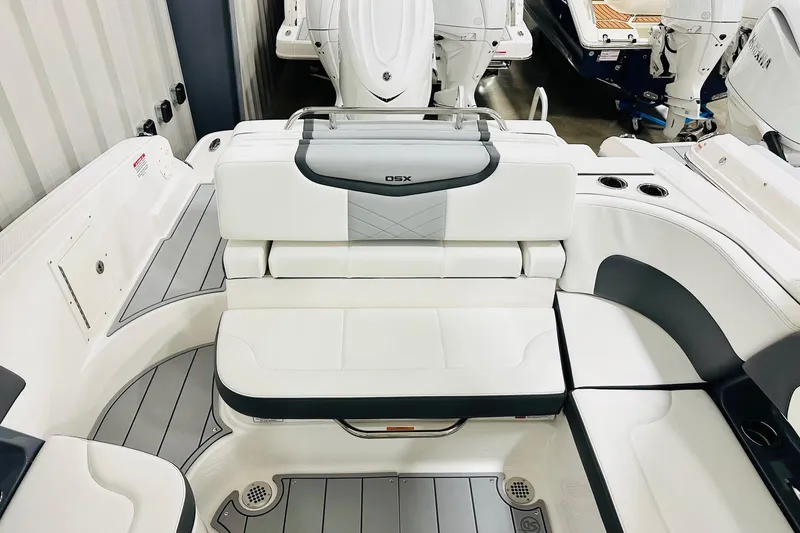 Slide: The Image of 2026 Chaparral 270 OSX boat interior with white seating and modern design. - 10