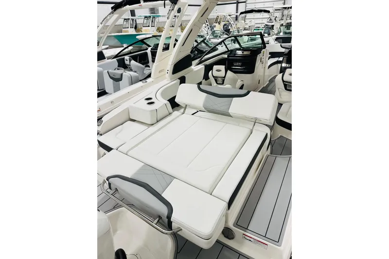 Slide: The Image of 2026 Chaparral 270 OSX boat interior with luxurious seating and modern design. - 11