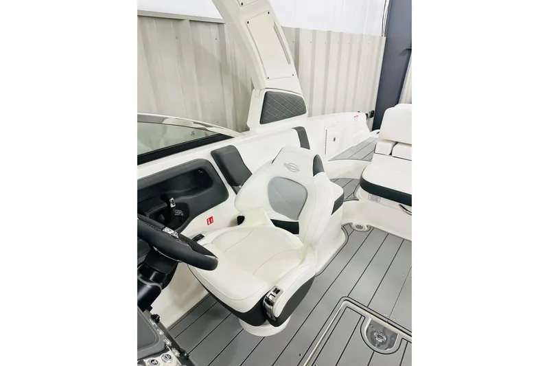 Slide: The Image of 2026 Chaparral 270 OSX boat interior with sleek white seating and modern design. - 4