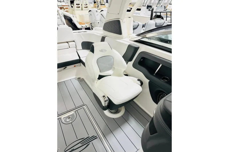 Slide: The Image of 2026 Chaparral 270 OSX boat interior with sleek white seating and modern design. - 5