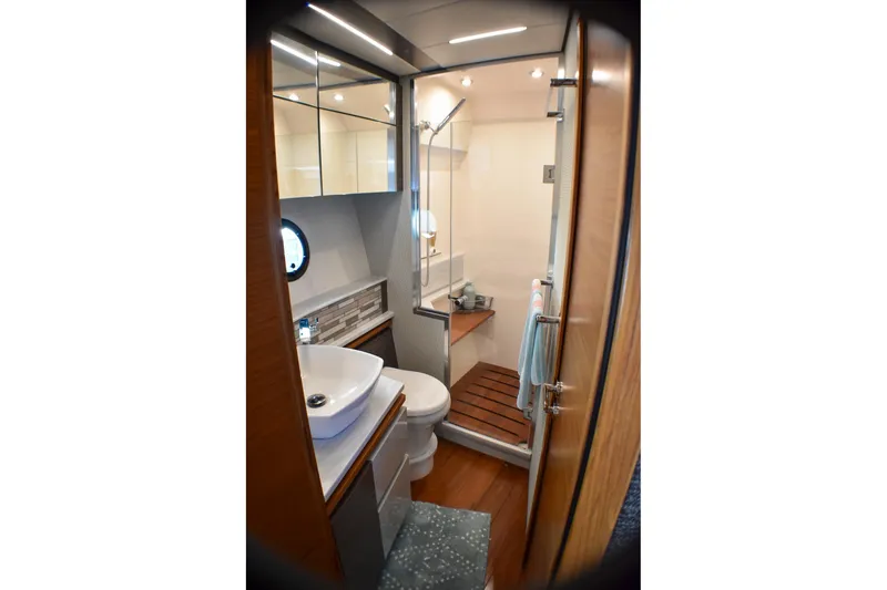 Slide: The Image of Luxurious bathroom in 2019 Tiara Yachts C49 Coupe with modern fixtures and elegant design. - 14