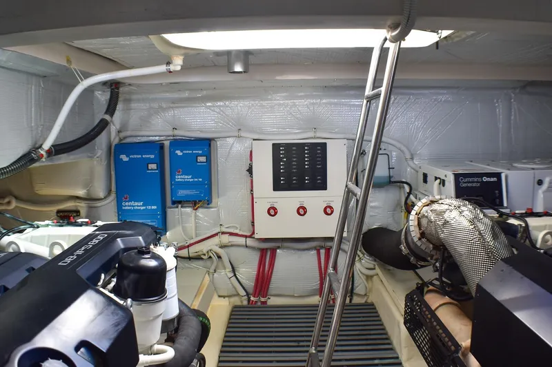 Slide: The Image of Engine room of 2019 Tiara Yachts C49 Coupe with electrical systems and generator. - 26
