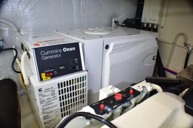 Slide: The Image of Cummins Onan generator in 2019 Tiara Yachts C49 Coupe engine room. - 27