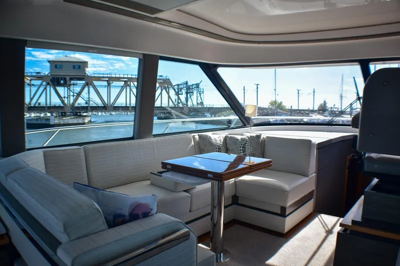 Slide: The Image of Luxurious interior of 2019 Tiara Yachts C49 Coupe with scenic marina view. - 28