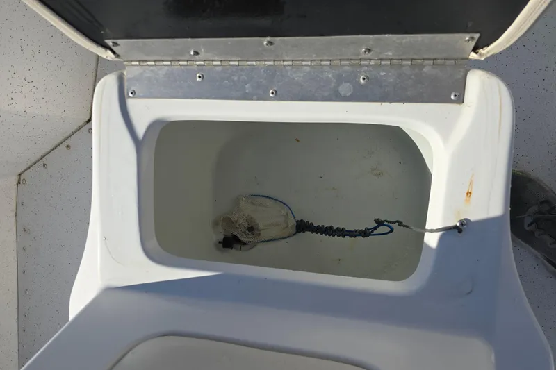 Slide: The Image of Open storage compartment on 2015 G3 Bay 18 DLX boat, showing interior details. - 14