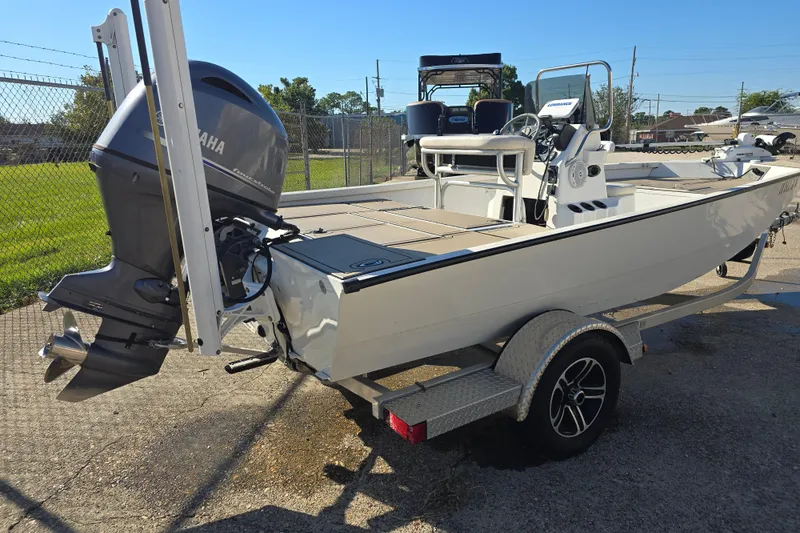 Slide: The Image of 2015 G3 Bay 18 DLX boat with Yamaha outboard motor on a trailer. - 4