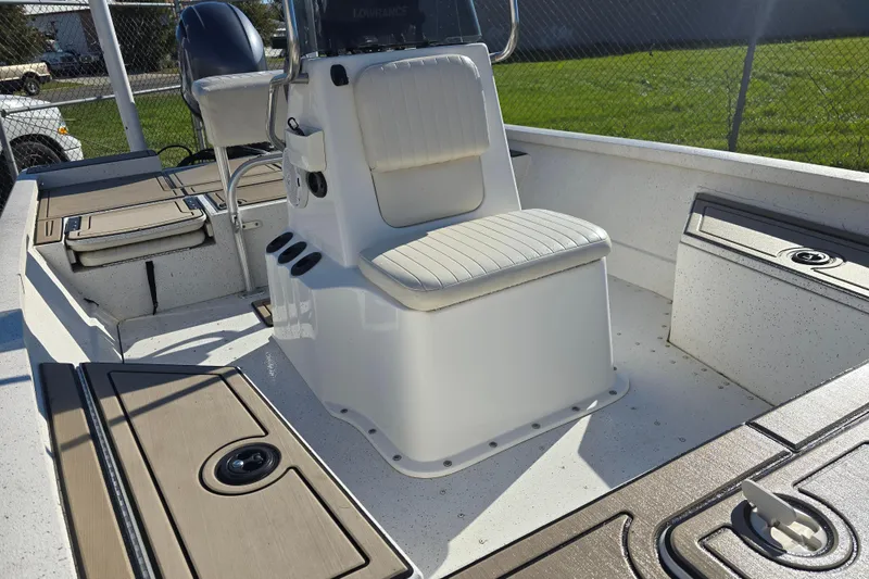 Slide: The Image of 2015 G3 Bay 18 DLX boat interior with seating and storage compartments. - 8