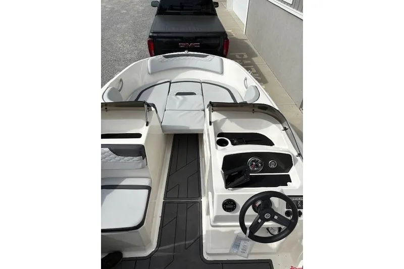 Slide: The Image of 2022 Bayliner Element M17 boat interior with steering wheel and seating. - 3