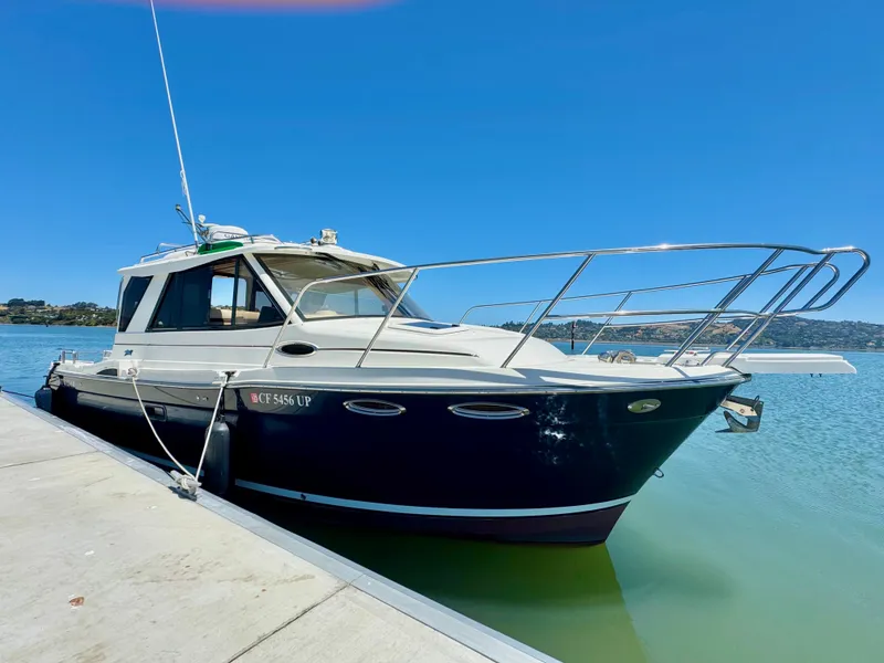 Slide: The Image of 2015 Cutwater C26 boat docked on a sunny day, clear blue sky. - 1
