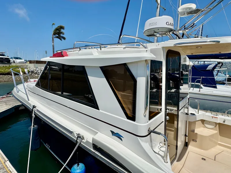 Slide: The Image of 2015 Cutwater C26 boat docked at marina, featuring sleek design and modern equipment. - 12