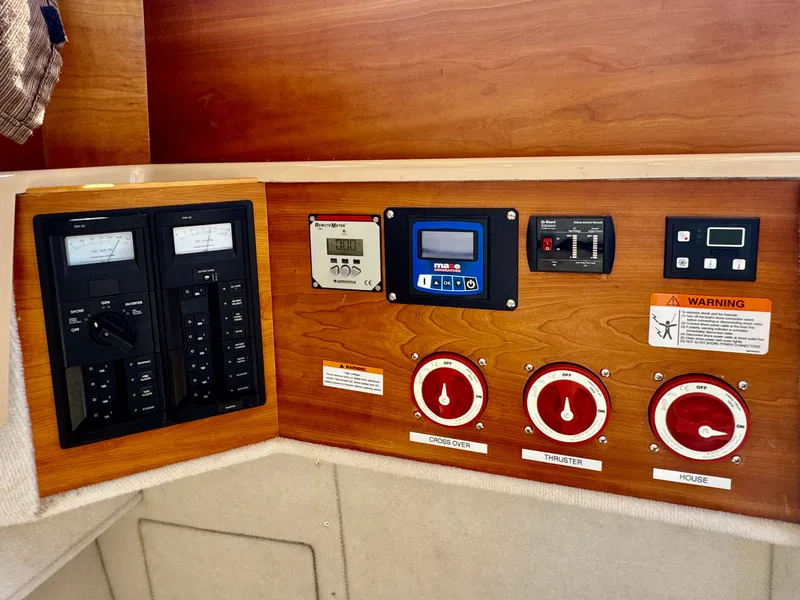 Slide: The Image of Control panel of a 2015 Cutwater C26 boat with switches and meters. - 22