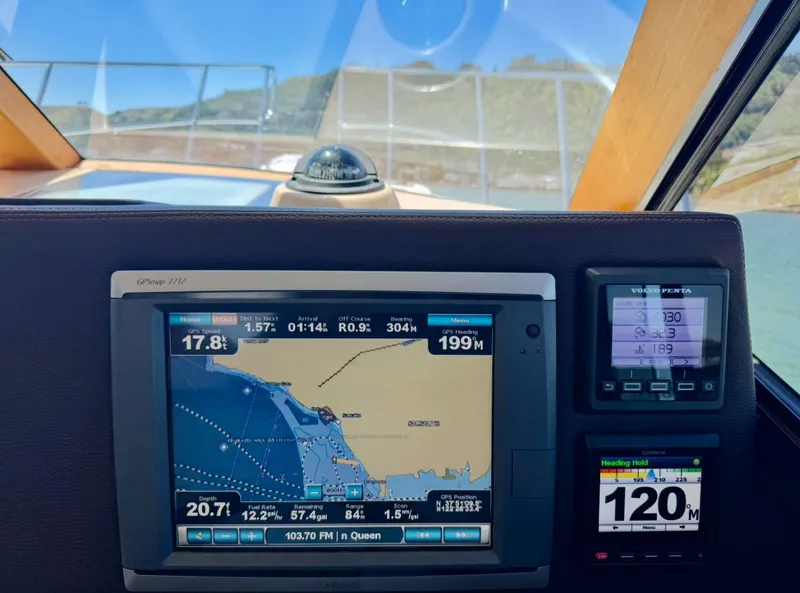 Slide: The Image of Cutwater C26 2015 boat dashboard with GPS navigation and control displays. - 31
