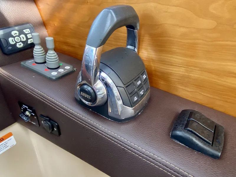 Slide: The Image of Control panel of a 2015 Cutwater C26 boat with Volvo Penta throttle. - 32