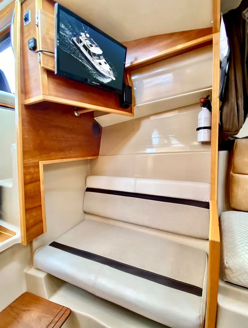 Slide: The Image of Interior of a 2015 Cutwater C26 boat with seating and mounted TV. - 39