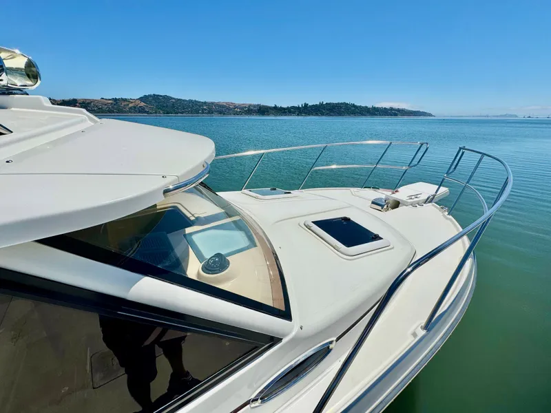 Slide: The Image of 2015 Cutwater C26 boat on calm water with scenic background. - 4