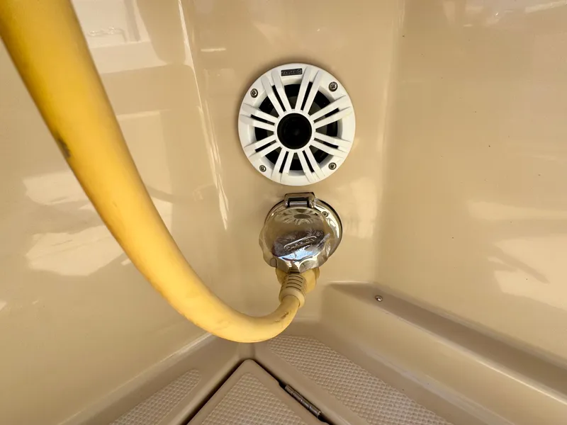 Slide: The Image of Power connection and speaker on 2015 Cutwater C26 boat. - 45