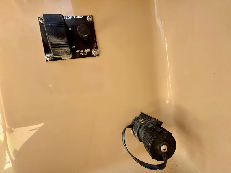 Slide: The Image of 2015 Cutwater C26 wash down pump switch and hose connection. - 46