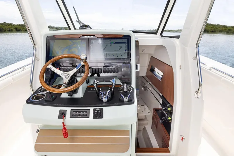 Slide: The Image of Manufacturer Provided Image: 2025 Pursuit S 328 Sport boat cockpit with advanced navigation system and luxurious interior. - 10