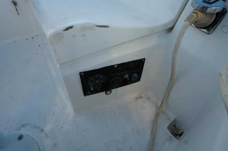 Slide: The Image of Control panel on 1986 Hunter 28.5 sailboat, featuring gauges and electrical connections. - 8