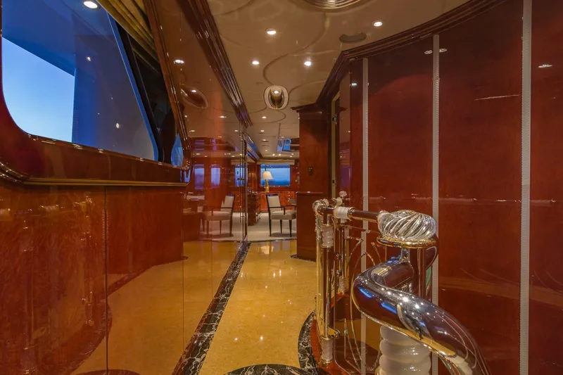 Slide: The Image of Luxurious interior of 2002 Christensen Tri Deck yacht with elegant wood finishes and modern lighting. - 21