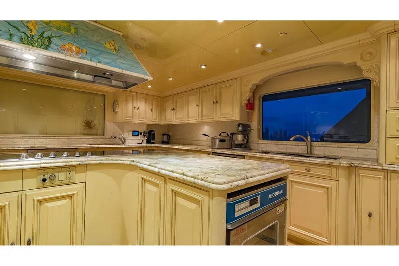 Slide: The Image of Luxurious kitchen interior on 2002 Christensen Tri Deck yacht with elegant cabinetry and modern appliances. - 25