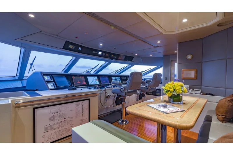 Slide: The Image of Luxurious 2002 Christensen Tri Deck yacht bridge with modern navigation equipment and elegant decor. - 28