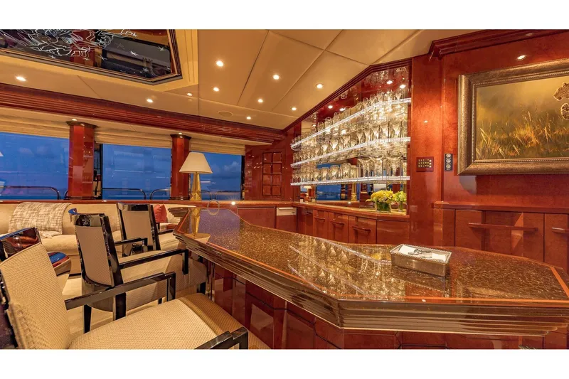 Slide: The Image of Luxurious interior of 2002 Christensen Tri Deck yacht with elegant bar and seating area. - 31