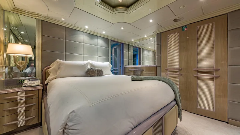 Slide: The Image of Luxurious bedroom interior on 2002 Christensen Tri Deck yacht, featuring elegant design and cozy ambiance. - 40